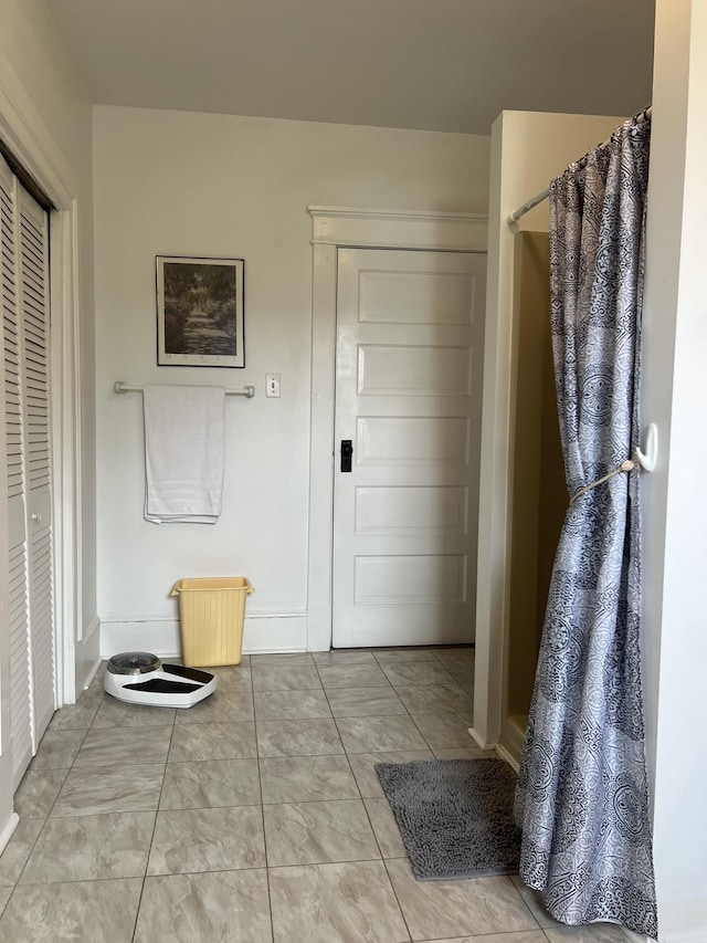 bathroom featuring tile patterned floors and walk in shower