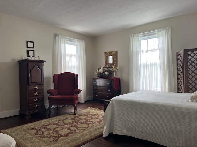 bedroom featuring dark hardwood / wood-style flooring