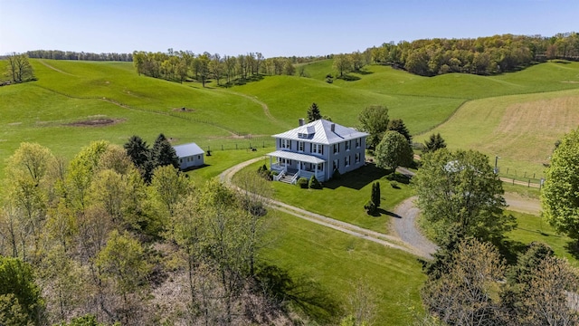 birds eye view of property featuring a rural view