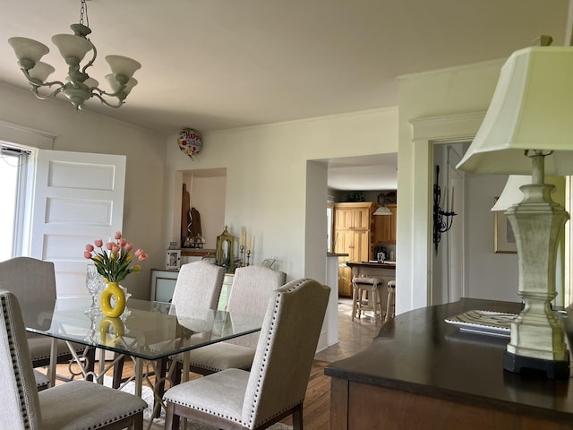 dining room featuring a notable chandelier and hardwood / wood-style floors