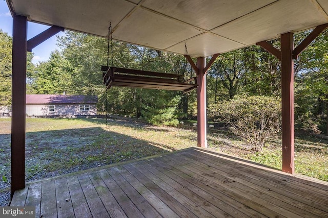 wooden terrace with a yard