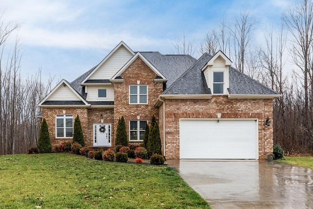 view of front of home featuring a garage and a front yard