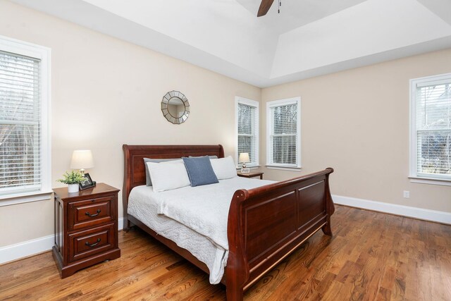 bedroom with hardwood / wood-style flooring and ceiling fan