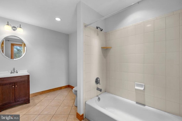 bathroom featuring shower / bathtub combination, tile patterned flooring, toilet, vanity, and baseboards