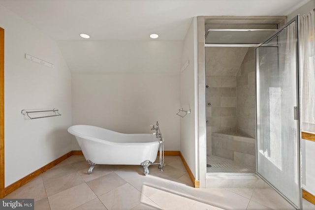 full bath with a stall shower, a soaking tub, and tile patterned floors