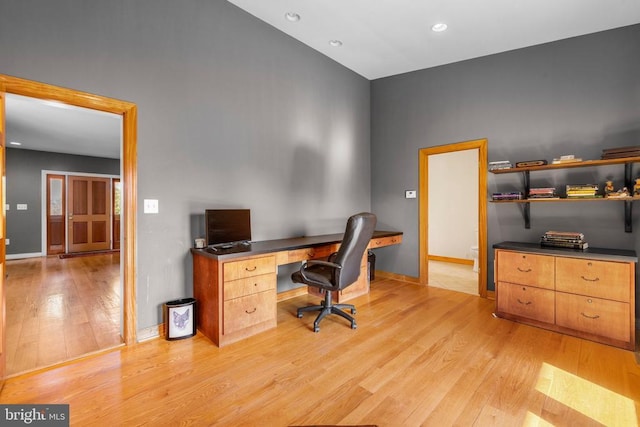 office featuring recessed lighting, baseboards, and light wood finished floors