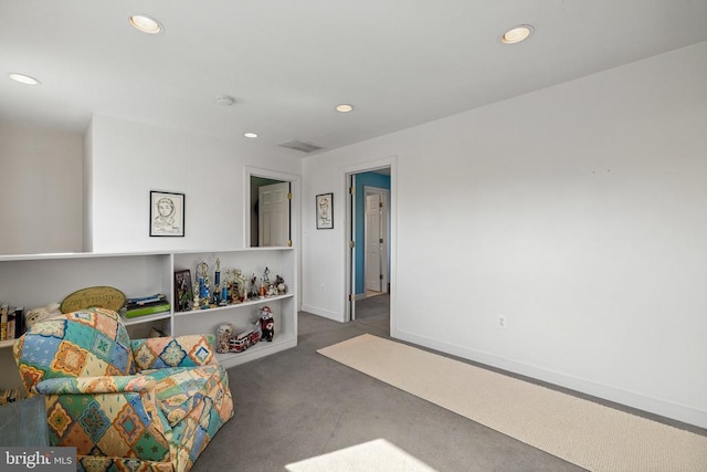 sitting room with carpet, visible vents, baseboards, and recessed lighting