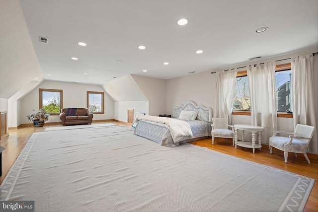 bedroom featuring recessed lighting, visible vents, vaulted ceiling, and wood finished floors