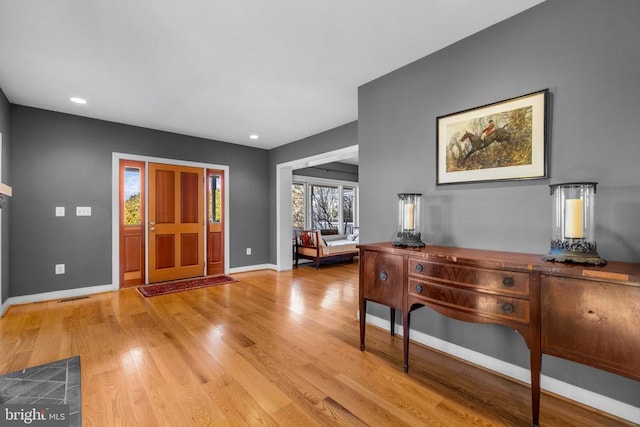 entrance foyer with visible vents, recessed lighting, light wood-style flooring, and baseboards