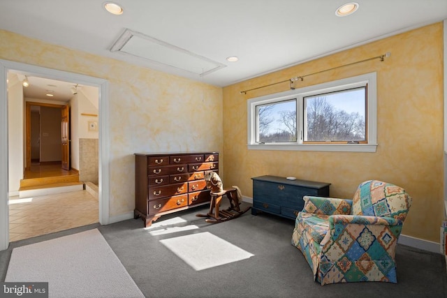 sitting room featuring carpet floors, attic access, baseboards, and recessed lighting