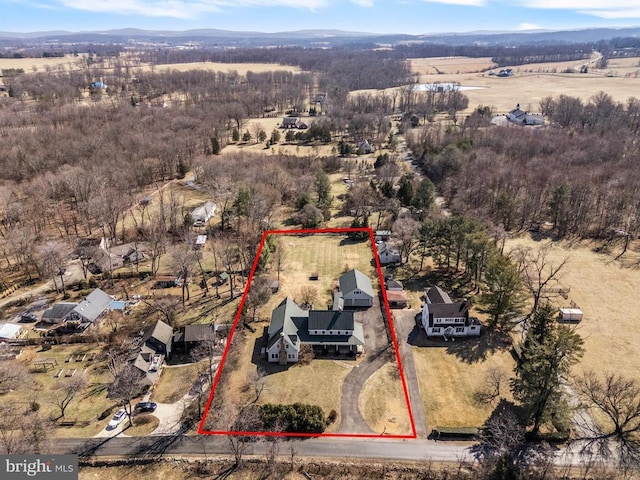 birds eye view of property featuring a rural view