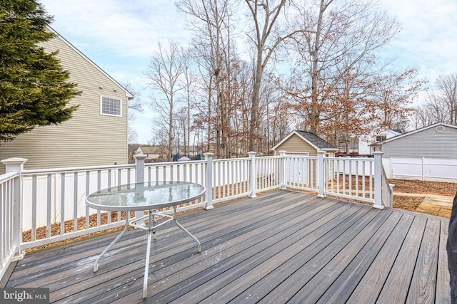 wooden terrace with an outdoor structure