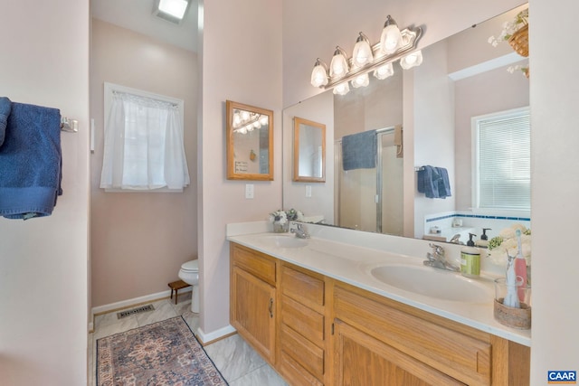 full bath with a sink, visible vents, double vanity, and a shower stall