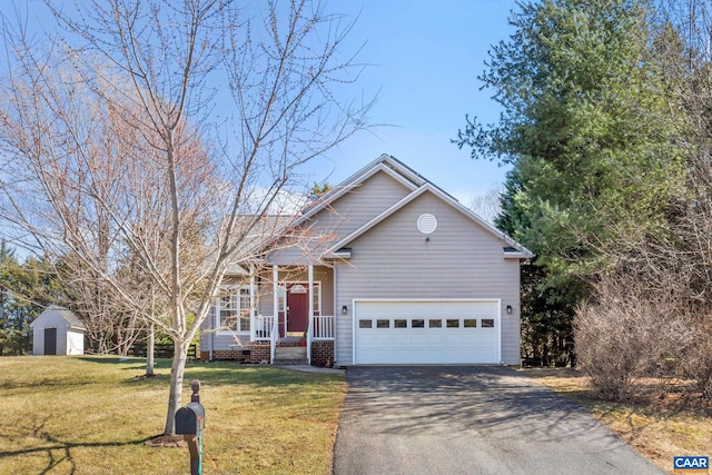 view of front of home with aphalt driveway, an attached garage, covered porch, and a front lawn