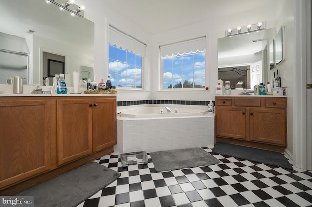 bathroom featuring vanity and plus walk in shower