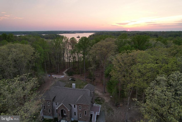 aerial view at dusk with a forest view