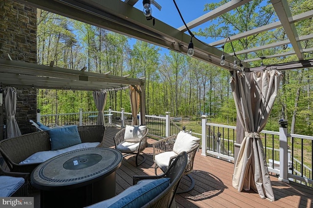 wooden deck featuring a pergola