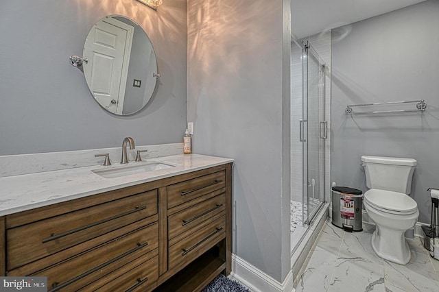 bathroom featuring toilet, marble finish floor, a shower stall, baseboards, and vanity