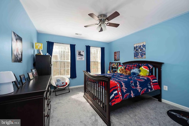 bedroom featuring light colored carpet, visible vents, and baseboards