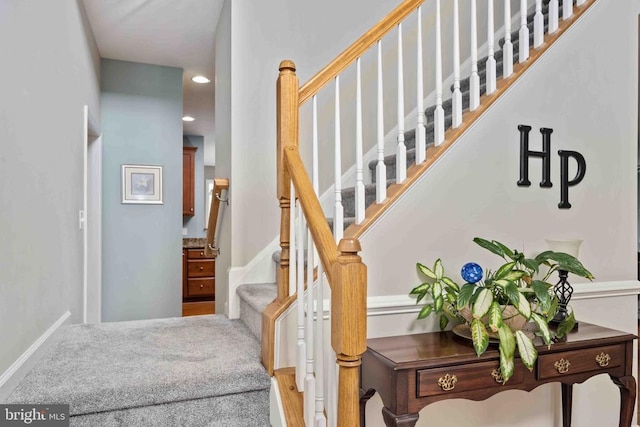 stairs featuring recessed lighting and baseboards