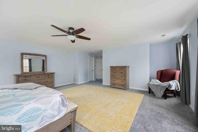 bedroom featuring a ceiling fan, light colored carpet, visible vents, and baseboards