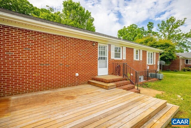 wooden deck with a yard