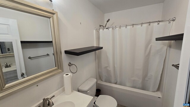 full bathroom featuring toilet, vanity, and shower / bathtub combination with curtain