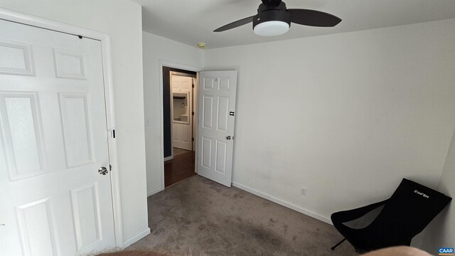 unfurnished room with light colored carpet and ceiling fan