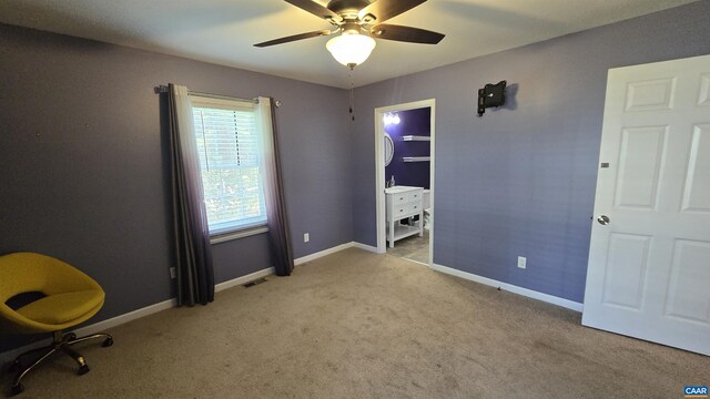 unfurnished bedroom with light carpet and ceiling fan