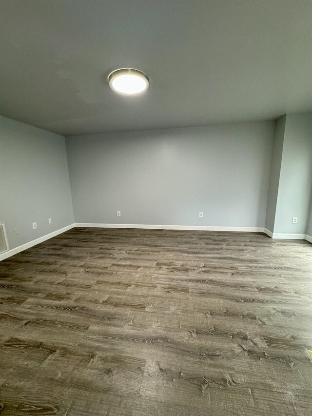 empty room with hardwood / wood-style floors