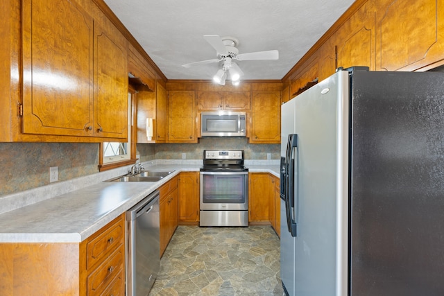 kitchen with stainless steel appliances, tasteful backsplash, sink, and ceiling fan