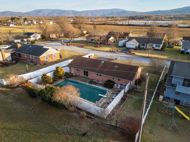 birds eye view of property featuring a mountain view