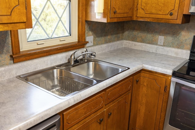 kitchen with sink and appliances with stainless steel finishes