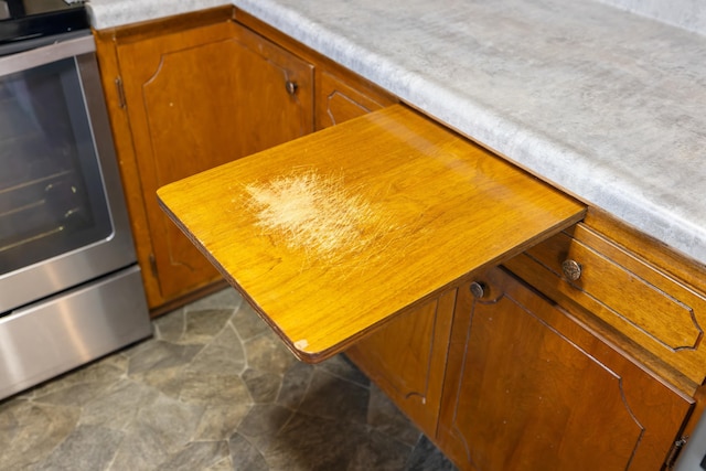 room details featuring stainless steel range with electric stovetop