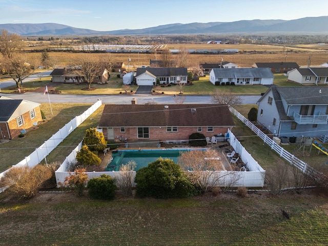 birds eye view of property featuring a mountain view