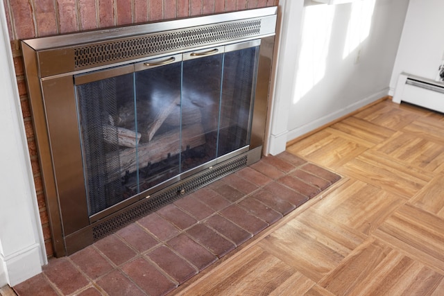 room details with a baseboard radiator and parquet flooring