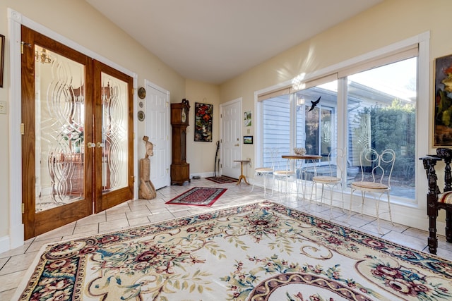 entryway featuring french doors and light tile patterned floors