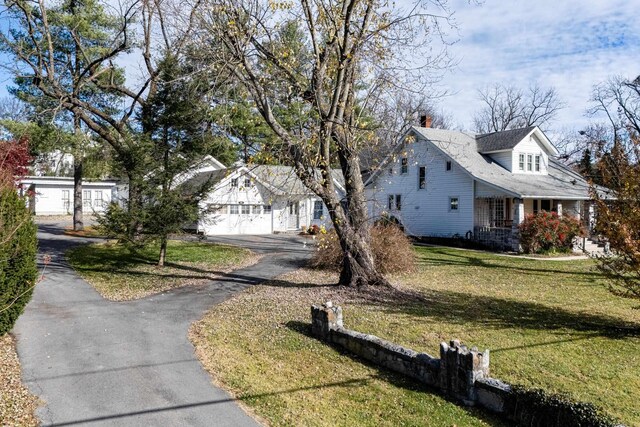 view of front of home with a garage and a front yard