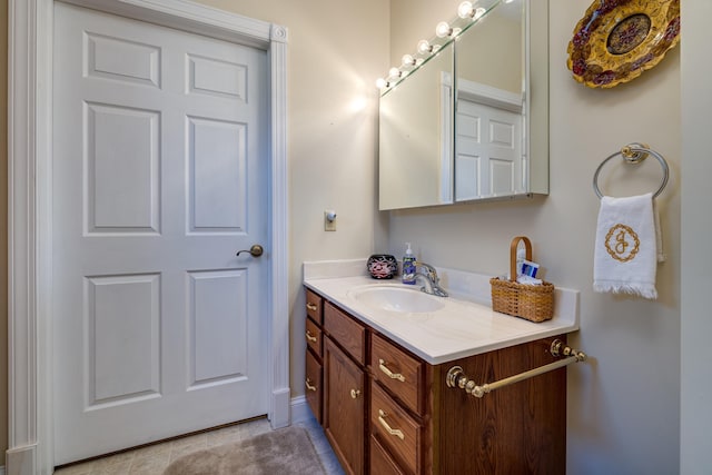 bathroom with tile patterned floors and vanity