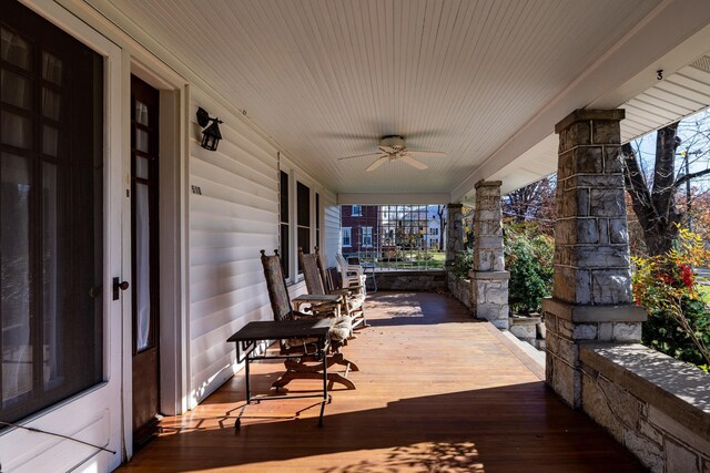 wooden deck with ceiling fan and covered porch