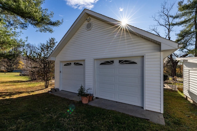 garage with a yard