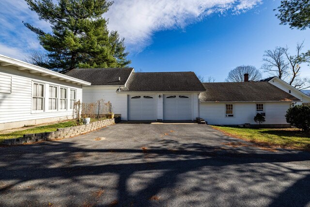 view of side of home with a garage