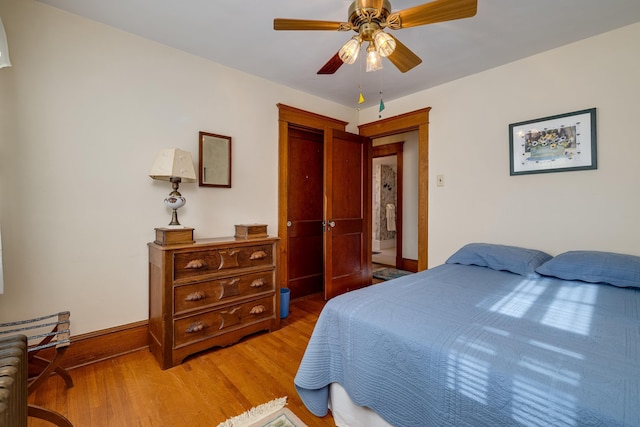 bedroom with hardwood / wood-style floors and ceiling fan