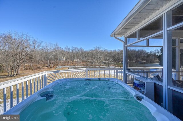 deck with a hot tub