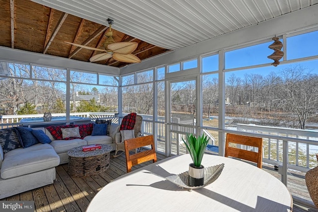 sunroom / solarium with plenty of natural light and a ceiling fan