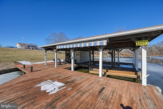 view of dock with boat lift