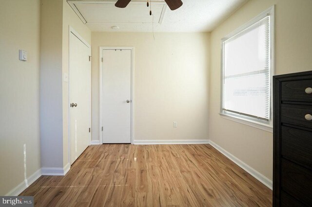 spare room with ceiling fan and light hardwood / wood-style floors