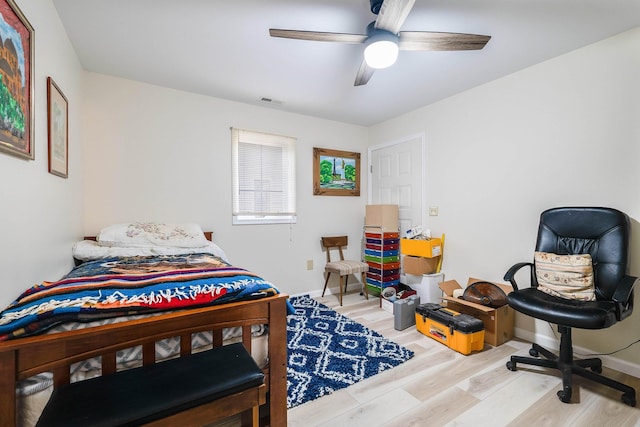 bedroom featuring ceiling fan and light hardwood / wood-style floors