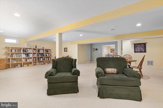 living area with visible vents, baseboards, beamed ceiling, carpet flooring, and recessed lighting