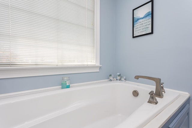 bathroom with a garden tub